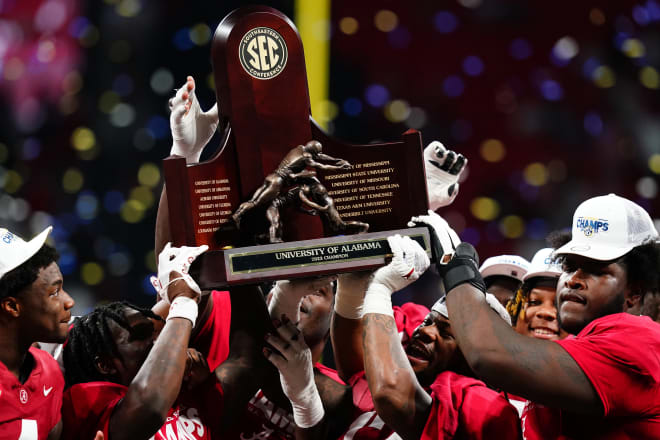 The Alabama Crimson Tide celebrates with the SEC championship trophy after defeating the Georgia Bulldogs at Mercedes-Benz Stadium. Photo | John David Mercer-USA TODAY Sports
