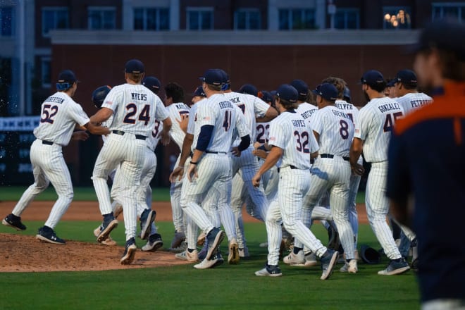 Auburn's players celebrate a walk-off win over Ole Miss