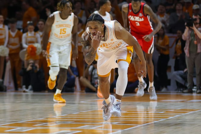 Jan 6, 2024; Knoxville, Tennessee, USA; Tennessee Volunteers guard Zakai Zeigler (5) reacts after shooting a three pointer against the Mississippi Rebels during the second half at Thompson-Boling Arena at Food City Center.