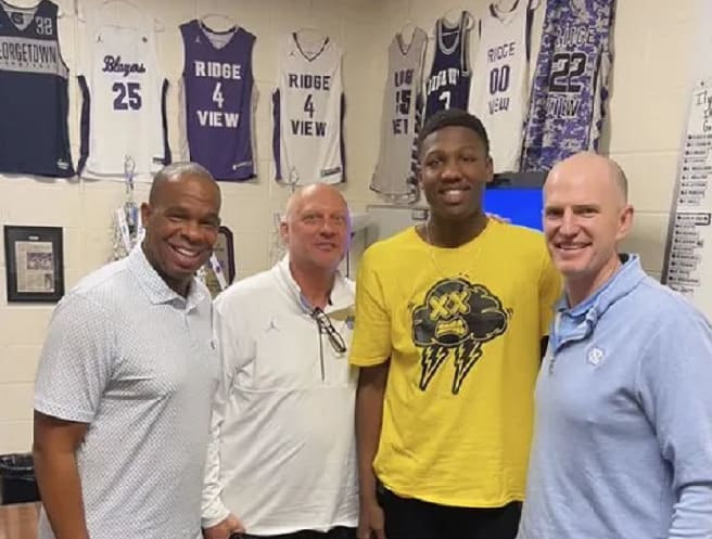 G.G. Jackson and UNC Coach Hubert Davis with assistants Jeff Lebo and Brad Frederick in a recent photo.