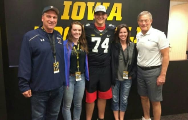 Offensive lineman Cody Ince and family with Iowa head coach Kirk Ferentz.