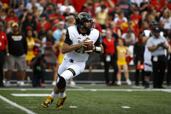 Towson quarterback Ryan Stover drops back to pass during a game against Maryland last season.