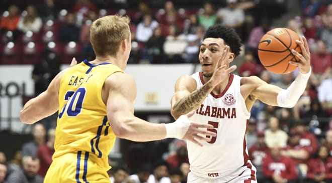 Alabama guard Jahvon Quinerly (5) controls the ball against South Dakota State guard Charlie Easley (30) at Coleman Coliseum. Photo | Gary Cosby Jr.-USA TODAY Sports