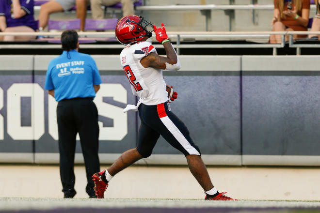 exas Tech Red Raiders wide receiver Ja'Lynn Polk (12) scores a touchdown during the third quarter against the TCU Horned Frogs at Amon G. Carter Stadium. Photo Credit: Andrew Dieb-USA TODAY Sports