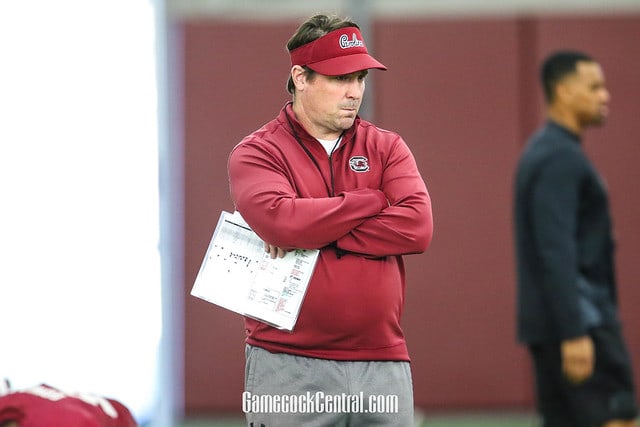 Will Muschamp looks on at a South Carolina spring practice.