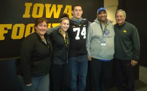 Jalen Mayfield and family with Iowa head coach Kirk Ferentz.
