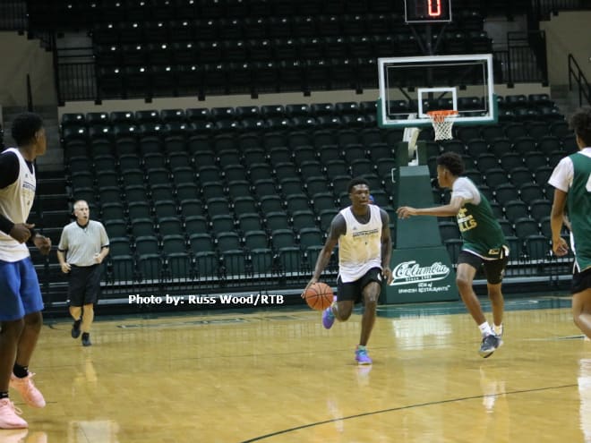 Tyrell Jones brings the ball up court during a game at the USF Elite Camp in the Yuengling Center.
