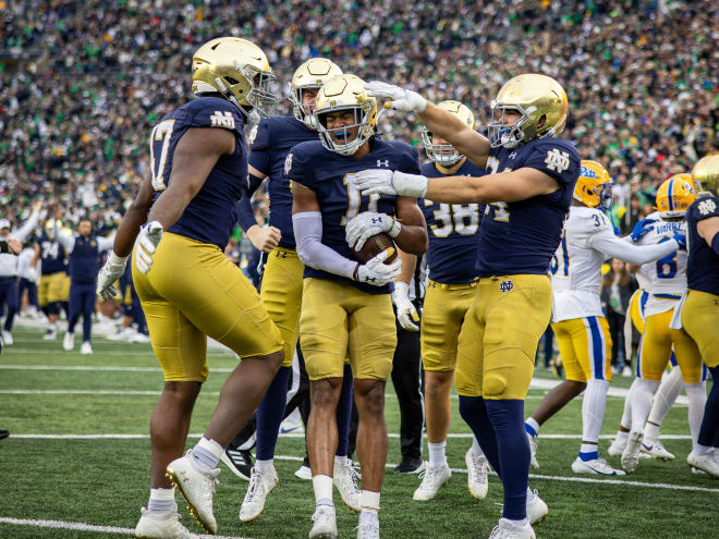 Ramon Henderson (middle) celebrates a Notre Dame touchdown against Pittsburgh on Oct. 28.