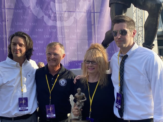 Josh Maravich, sculptor Brian Hanlon, Jackie Maravich McLachlan and Jaeson Maravich pose after Monday's statue reveal of former LSU basketball great "Pistol Pete" Maravich in front of the LSU basketball practice facility
