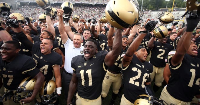 Linebacker Andrew King (11) and head coach Jeff Monken (white shirt) have an opportunity at a winning season and ending the losing streak versus Notre Dame.