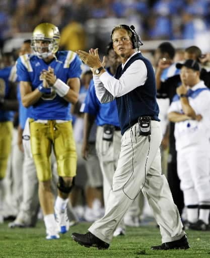 UCLA head coach Rick Neuheisel and quarterback Kevin Craft, left, clap their hands after teammate Kai Forbath make a field goal in overtime against Tennessee in a college football game, Monday, Sept. 1, 2008, in Pasadena, Calif.