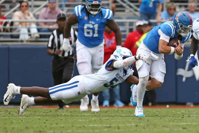 Ole Miss Rebels quarterback Jaxson Dart (2) runs the ball as Kentucky Wildcats linebacker D’Eryk Jackson (54) makes the tackle during the first half at Vaught-Hemingway Stadium. Mandatory Credit: Petre Thomas-Imagn Images