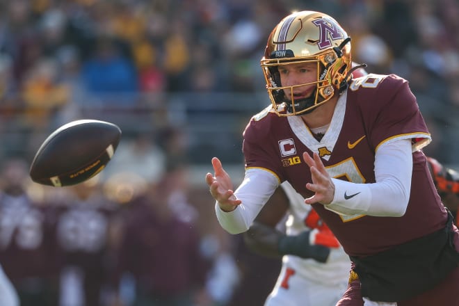 Nov 4, 2023; Minneapolis, Minnesota, USA; Minnesota Golden Gophers quarterback Athan Kaliakmanis (8) tosses the ball to running back Jordan Nubin (30) during the first half against the Illinois Fighting Illini at Huntington Bank Stadium. Mandatory Credit: Matt Krohn-USA TODAY Sports