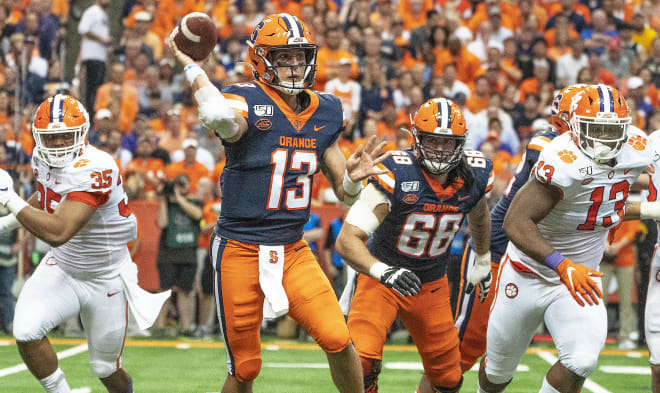 Syracuse quarterback Tommy DeVito operated under unrelenting pressure from Clemson's defense all night Saturday.
