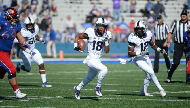 Nick Orr (18) returns one of his two interceptions against Kansas on