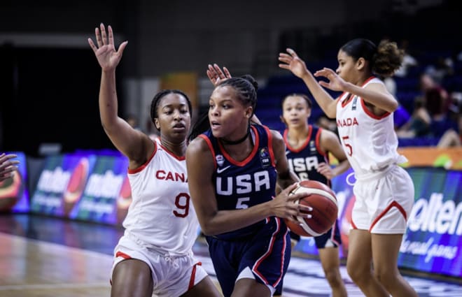 With Team USA teammate Hannah Hidalgo (6) in the background, Notre Dame recruiting target Mackenley Randolph makes a move during a FIBA World Cup game against Canada. 
