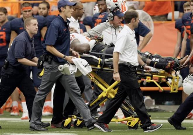 Andrew Isaacs being carted off the field at Syracuse after suffering a knee injury in 2014. 