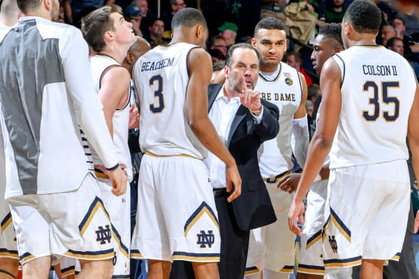 Mike Brey (center) and the Irish have lost three straight games after starting ACC play 6-1.