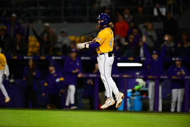 LSU third baseman Tommy White hops as he watches his three-run home run land in the left field stands for the Tigers' first runs in an eventual 16-0 win over UNO Tuesday night in Alex Box Stadium.