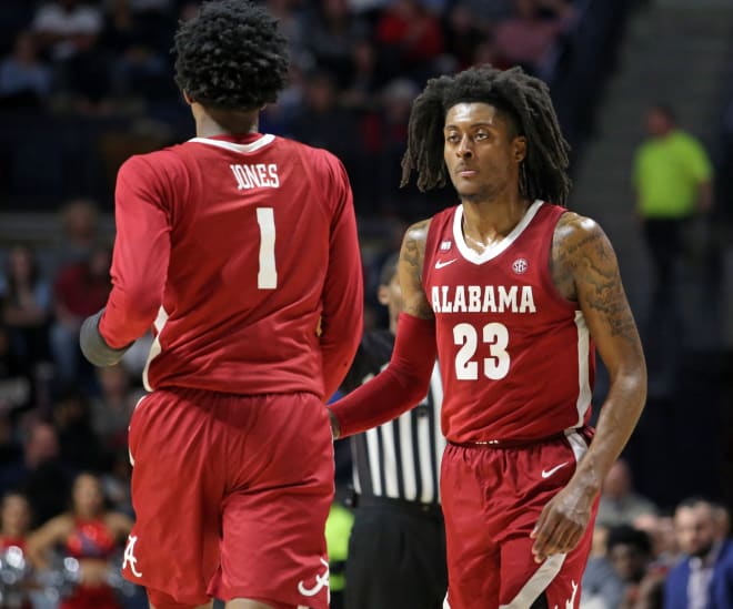 Alabama Crimson Tide guard John Petty Jr. (23) and Alabama Crimson Tide forward/guard Herbert Jones (1) celebrate during the second half against the Mississippi Rebels at The Pavilion at Ole Miss. Photo | Imagn