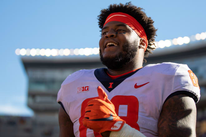 Illinois Fighting Illini defensive lineman Keith Randolph Jr. (88) celebrates a win against the Minnesota Golden Gophers at Huntington Bank Stadium.