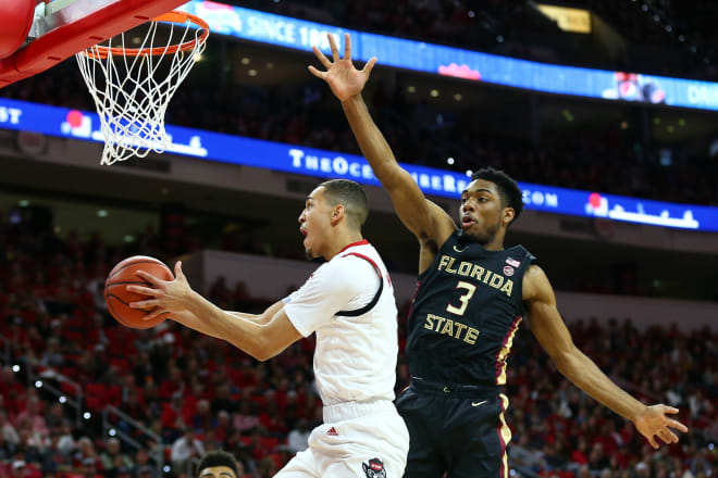 FSU guard Trent Forrest attempts to block a shot Saturday at N.C. State.