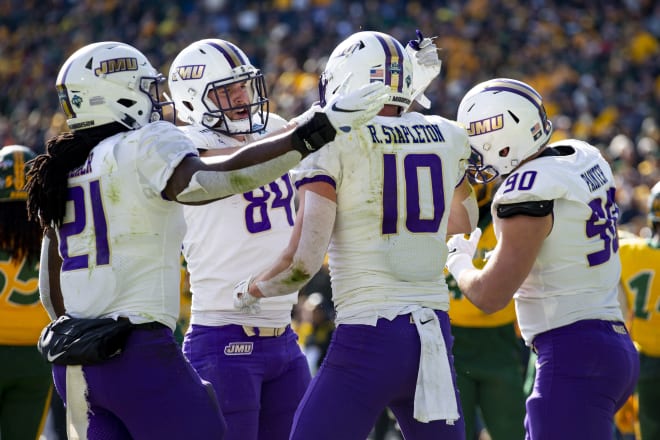 James Madison players celebrate after scoring a touchdown during the FCS national championship game last year at Toyota Stadium in Frisco, Texas. 