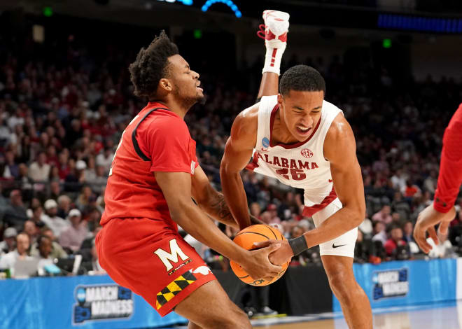 Maryland Terrapins guard Jahari Long (2) and Alabama Crimson Tide guard Nimari Burnett (25) tie up the ball during the first half at Legacy Arena. Photo | Marvin Gentry-USA TODAY Sports
