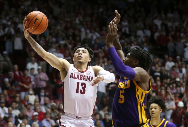 Alabama guard Jahvon Quinerly (13) drives to the hoop against LSU forward Mwani Wilkinson (5) in Coleman Coliseum. Photo | Gary Cosby Jr. / USA TODAY NETWORK
