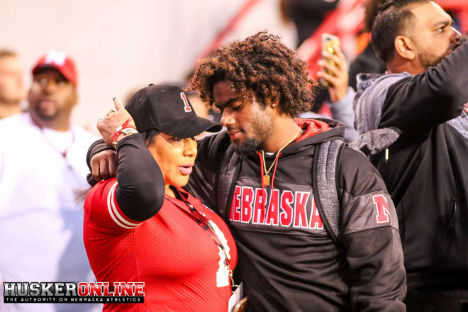 Cornerback commit Brendan Radley-Hiles and his mother share a moment during Nebraska's Tunnel Walk on Saturday night.