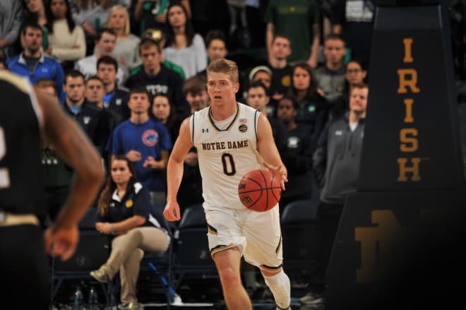 Sophomore guard Rex Pflueger takes the ball up the court during Notre Dame's 89-64 victory over Bryant to start the 2016-2017 campaign.