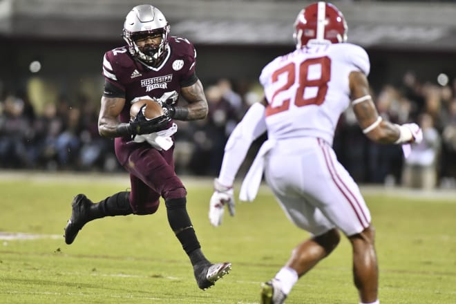 Mississippi State Bulldogs running back Aeris Williams (22) runs the ball as he is defended by Alabama Crimson Tide defensive back Anthony Averett (28) during the first quarter at Davis Wade Stadium. Photo | USA Today