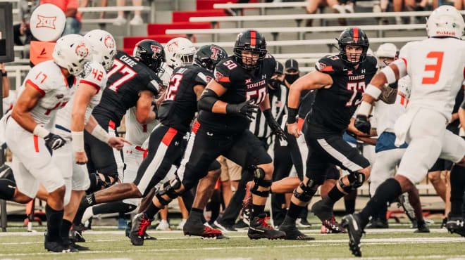 Texas Tech super senior Josh Burger (50) made his first career start at center vs. West Virginia.