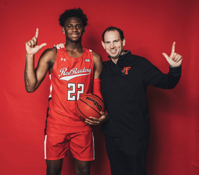 Elijah Fisher with Texas Tech assistant Sean Sutton