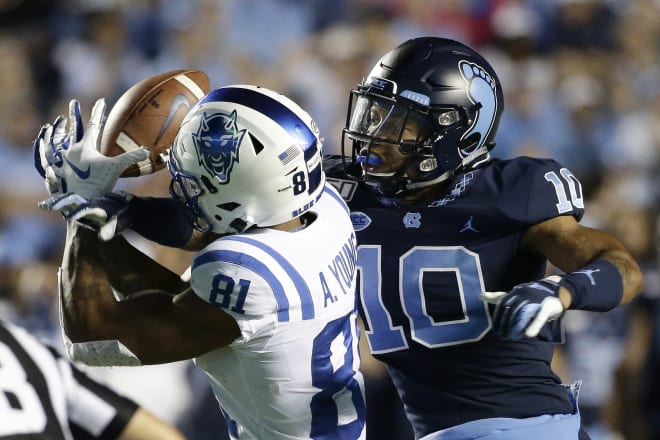 Former North Carolina defensive back Greg Ross (10) breaks up a pass during a 2019 game against Duke in Chapel Hill, N.C.