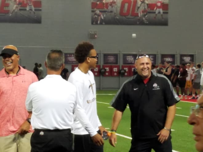 Blue Smith and his father sharing a laugh with Urban Meyer and Zach Smith on Saturday.