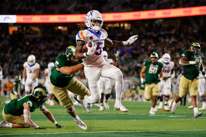Oct 30, 2021; Fort Collins, Colorado, USA; Boise State Broncos wide receiver Stefan Cobbs (5) runs for a touchdown against Colorado State Rams defensive back Jack Howell (17) and linebacker Sanjay Strickland (39) in the third quarter at Sonny Lubrick Field at Canvas Stadium. Mandatory Credit: Isaiah J. Downing-USA TODAY Sports