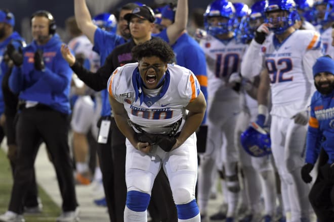 Boise State linebacker Curtis Weaver reacts after teammate Tyric LeBeauf almost intercepted a pass against Utah State in the second half of an NCAA college football game Saturday, Nov. 23, 2019, in Logan, Utah.