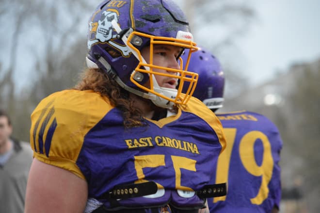 ECU senior Garrett McGhin who can play a multitude of positions is pictured going through a wet Monday workout.