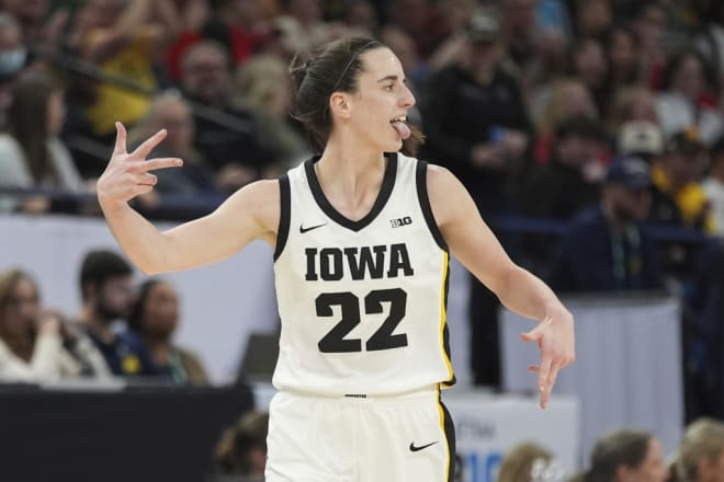 Iowa guard Caitlin Clark celebrates after making a 3-point basket against Michigan in the semifinals of the Big Ten women's tournament Saturday.