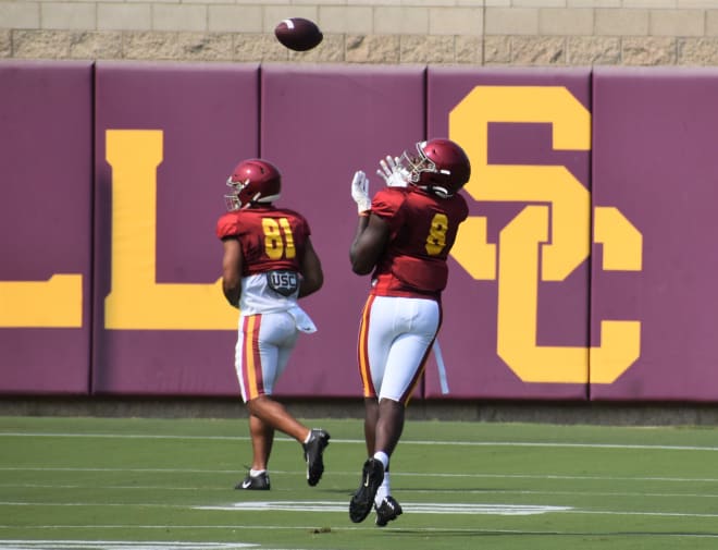 Freshman tight end Michael Trigg (No. 8), pictured here in an earlier practice, made the two biggest plays for the Trojans on Tuesday.