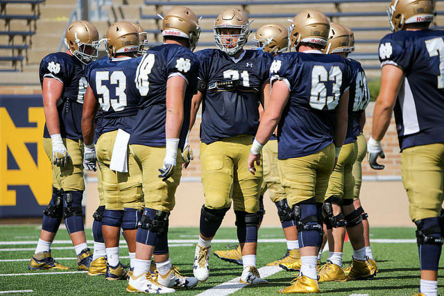 Senior Alex Bars (in middle with rolled up 71) can play any position along the offensive line.