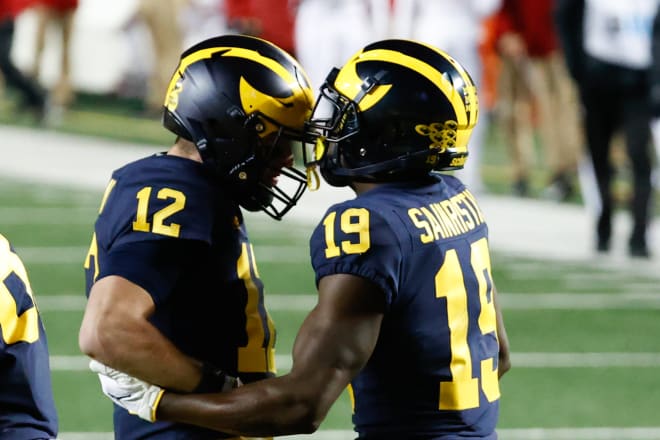 Michigan Wolverines football quarterback Cade McNamara connected with wideout Mike Sainristil for a 23-yard score against the Wisconsin Badgers. 