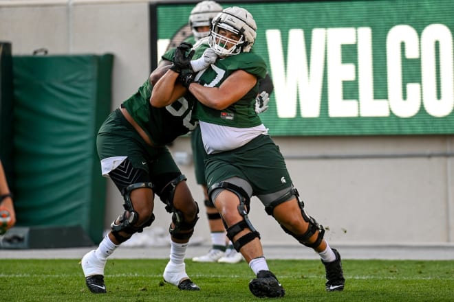 Ethan Boyd (No. 77) goes through a drill in August of 2021. 