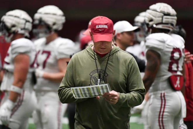 Alabama head coach Kalen DeBoer checks his play sheet during practice in the Hank Crisp Indoor Practice Facility at the University of Alabama. Photo | Gary Cosby Jr.-Tuscaloosa News / USA TODAY NETWORK