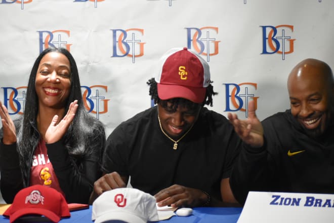 Four-star Rivals100 safety Zion Branch at his signing ceremony at Bishop Gorman HS in Las Vegas with his parents Renee and Sheva Branch.