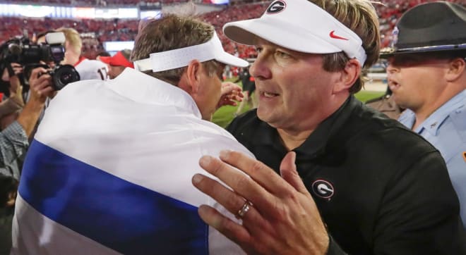 Florida's Dan Mullen and Georgia's Kirby Smart are both playing coy about their QB for Saturday.