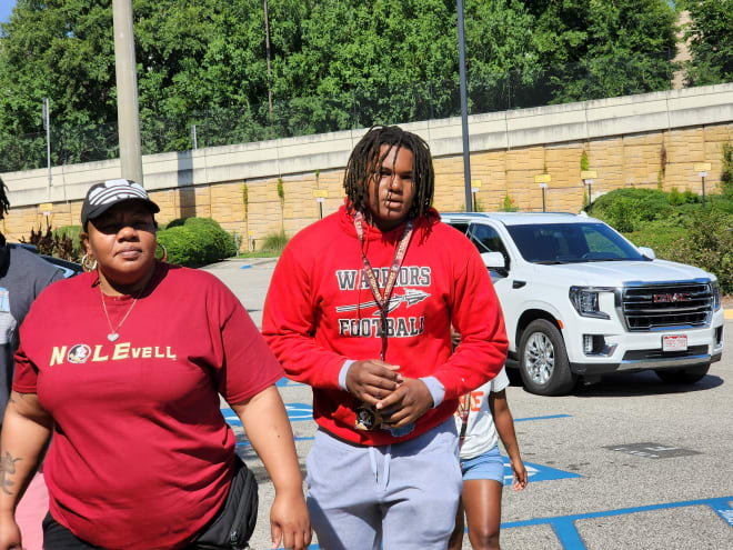 DT Tavion Gadson arrives with his family during official visit.