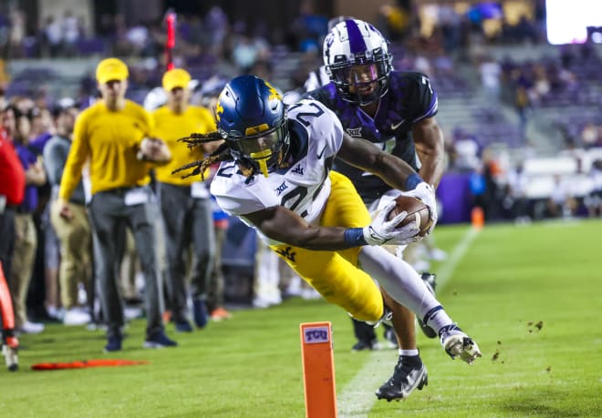 West Virginia Mountaineers running back Tony Mathis Jr. (24) dives for the endzone during the second half against the TCU Horned Frogs at Amon G. Carter Stadium.