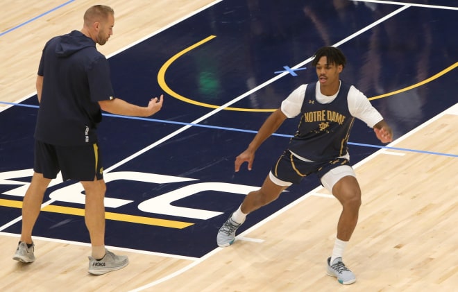 Seton Hall transfer Tae Davis (right) runs a drill during a recent Notre Dame men's basketball practice.